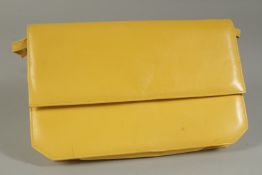 A RAYNUS RENE YELLOW LEATHER BAG with leather handles.