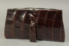 A 1950's -1960's CROCODILE SKIN EVENING BAG, tapering to 10ins.