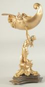 A GILT BRONZE CLASSICAL FIGURE holding a shell. 15ins high.