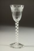 AN 18TH CENTURY ENGLISH WINE the bowl with roses and scrolls with white twist stem. 6ins high.