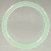 A CHINESE ICY CELADON JADE BANGLE.