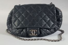 A LARGE NAVY BLUE LEATHER CHANEL PADDED BAG with entwined chrome and leather straps, 21ins long. No.