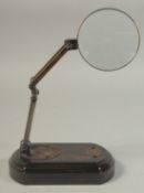 A SMALL MAGNIFYING GLASS on a stand.