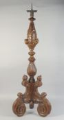 A GOOD 17TH - 18TH CENTURY CARVED AND GILDED ITALIAN PRICKET CANDLESTICK with cupids' heads, on