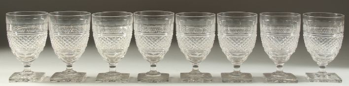 A SET OF EIGHT HOBNAIL CUT RUMMERS on square bases.