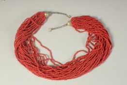 A MULTI CORAL BEAD NECKLACE.