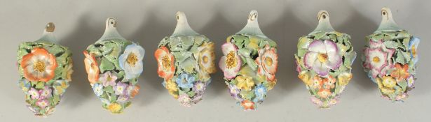 A GOOD SET OF SIX MEISSEN PORCELAIN FLOWER ENCRUSTED TREE DECORATIONS. 3.75ins long.