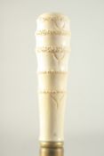 A WALKING STICK with carved bone handle, 'HAND'.