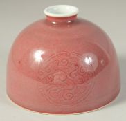 A CHINESE COPPER RED GLAZE WATERPOT. 12.5cm high.