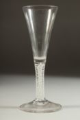 A GOOD 18TH CENTURY ENGLISH WINE GLASS with tapering bowl and white twist stem. 7.5ins