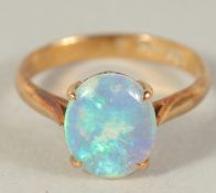 A 14CT GOLD OPAL RING.