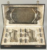 A GOOD W M F METAL ART DECO LIQUEUR SET comprising: two handled tray, 18.5ins long, 9 ins wide, a