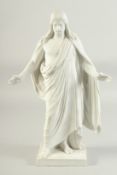 A COPENHAGEN WHITE PARIAN WARE FIGURE OF JESUS CHRIST on a square base. Marl in blue. 14ins high.