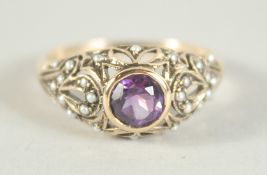 A 9CT. GOLD AMETHYST AND PEARL RING.