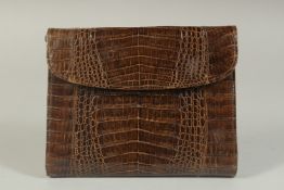 AN A R WEST GERMANY, BROWN CROCODILE SKIN HANDBAG, 6.5ins long, with rope handles.