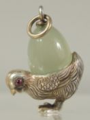 A SILVER AND JADE CHICK PENDANT.