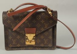 A LOUIS VUITTON LEATHER BAG with long and short handles. 9.5ins long.