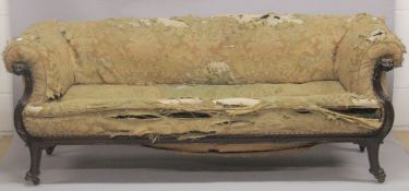 A GOOD LATE GEORGIAN MAHOGANY SETTEE ATTRIBUTED TO THOMAS HOPE, in need of restoration, with curving