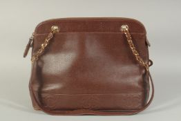 A LARGE CHANEL BROWN LEATHER BAG, made in Italy, 14ins long, 8ins high with two leather straps.