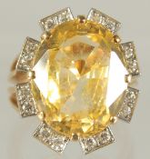 A SUPERB CUSHION CUT, OVAL, YELLOW SAPPHIRE, approx. 15 carat, surrounded by eight pairs of diamonds