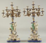 A GOOD PAIR OF SEVRES DESIGN PORCELAIN TEN LIGHT CANDELABRA with gilt metal branches, the base