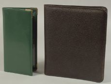 A SAUDI INTERNATIONAL BLACK LEATHER WALLET AND A LEATHER FOLDER. (2)