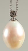 AN 18CT WHITE GOLD LARGE PEARL AND DIAMOND PENDANT AND CHAIN.
