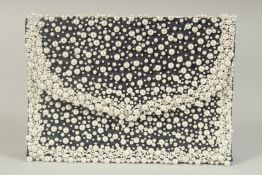 A BLUE VELVET AND PEARL EVENING BAG the inside with a small mirror. 7.5ins long.