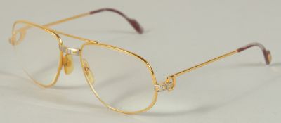 A CARTIER, PARIS, GOLD SPECTACLES, stamped, Cartier, Paris, 56 18, in a leather case.