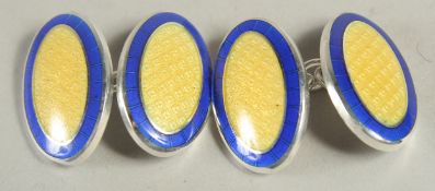 A PAIR OF STERLING SILVER AND ENAMEL OVAL SHAPED CUFFLINKS.