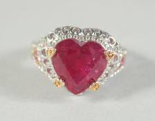 A SILVER AND RUBY HEART RING.