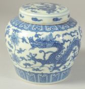 A CHINESE BLUE AND WHITE PORCELAIN GINGER JAR decorated with dragons. 12cm high.