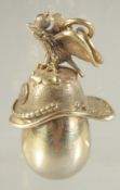 A SMALL RUSSIAN SILVER GILT EAGLE AND HELMET EGG PENDANT.