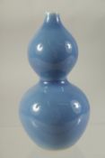 A SMALL CHINESE BLUE GOURD VASE. 4.5ins high.