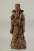A CARVED HORN CHINESE DEITY. 8ins high.