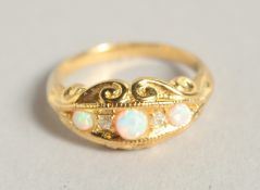 A SILVER AND 18 CT GOLD PLATED OPAL AND DIAMOND RING.