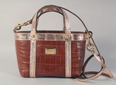 A GOOD DOLCE AND GABBANA BLACK CROCODILE OR SNAKESKIN BAG, brown and gold. 9.5ins long 6ins high