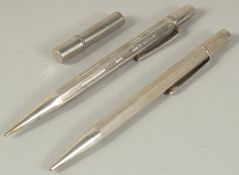 TWO SILVER PENS.