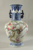 A CHINESE PORCELAIN VASE painted with children and peaches. 14ins high.