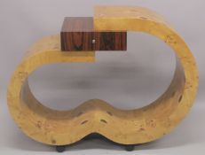 AN ART DECO STYLE SINGLE DRAWER CONSOLE TABLE of curving design. 4ft wide x 3ft high x 1ft 4ins