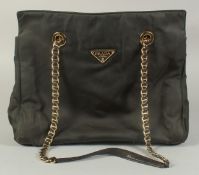 A PRADA MILANO SOFT BLACK BAG, 12ins, 10ins high with entwined gilt metal and leather strap.