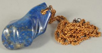 A GOOD PIECE OF LAPIS on a gold chain. Lapis 40gms.