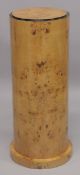 AN ART DECO STYLE BLONDWOOD CIRCULAR PEDESTAL STAND. 2ft 7ins high x 1ft diameter.