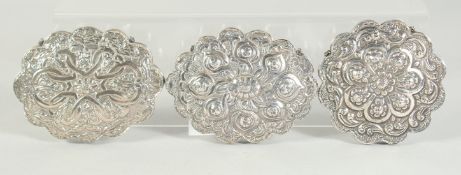 THREE OVAL SILVER CLAD OTTOMAN MIRRORS.