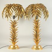 A PAIR OF GILT BRONZE PALM TREE LAMPS. 28ins high.