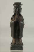 A CHINESE BRONZE FIGURE OF A DEITY. 12ins high.