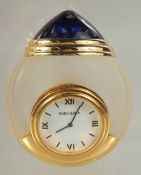 A BOUCHERON GLASS CLOCK in a case. 3ins