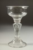 A LARGE 18TH CENTURY ENGLISH GLASS with circular bowl. 3.56ins diameter and moulded stem. 6.25ins