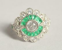 A SILVER DECO STYLE RING WITH CUBIC ZIRCONIA AND EMERALD.