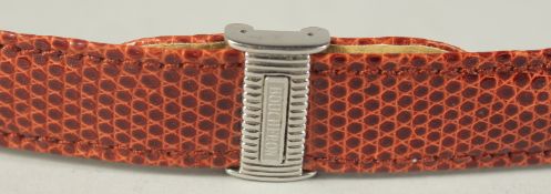 A BOUCHERON RED LEATHER WATCH STRAP